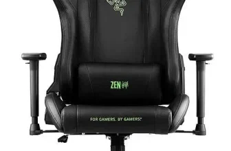 Schwarzer ZEN Razer Edition Gaming-Stuhl mit grünen Logos, Kopfstütze und Lendenwirbelstütze
