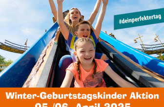 Kind mit Geburtstagsmütze im Freizeitpark