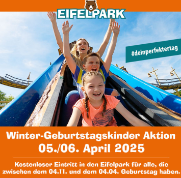 Kind mit Geburtstagsmütze im Freizeitpark