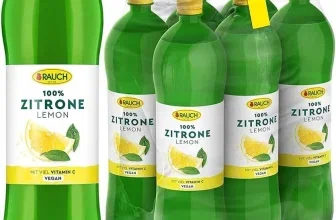 Grünes Plastikflaschenpaket mit sechs Ein-Liter-Flaschen Rauch 100% Zitrone Lemon, gelbe Verschlüsse und weißem Etikett mit Zitronenmotiv.