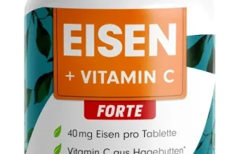 Eine weiße Tablettendose mit orangem Etikett und grünen Blättern, auf dem 'Eisen + Vitamin C' steht.