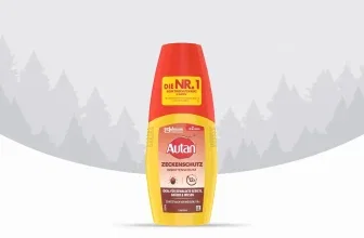 Ein Insektenschutzmittel in einer gelben und roten Sprayflasche vor einem Waldhintergrund