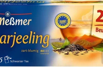Meßmer Darjeeling Teebox mit 25 Beuteln, blau-gelbes Design, Abbildung von Tee und Bergen