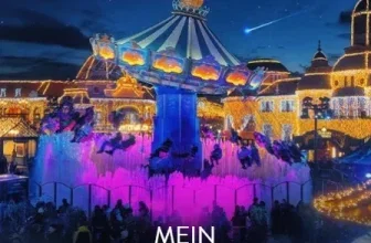 Beleuchteter Karussell-Platz im Phantasialand bei Nacht mit pinken Lichteffekten und dem Text Mein Phantastischer Wintertraum.