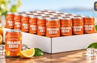 Orange Zero Dose in weißem Karton mit frischen Orangen und Eiswürfeln auf Holz