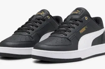 Schwarze Puma Caven 2.0 Sneaker mit weißer Sohle und goldenen Details