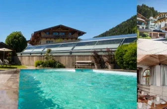 Ein Pool mit Liegestühlen und Sonnenschirmen neben einem Hotel