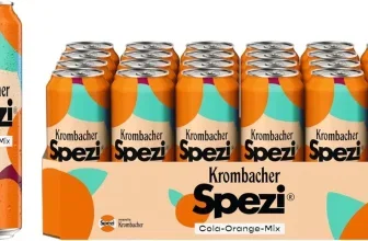 Krombacher Spezi 24er Dosentray mit orangefarbenen Dosen und einer einzelnen Dose im Vordergrund