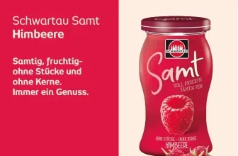 Ein Glas Schwartau Samt Himbeere Fruchtaufstrich mit Himbeeren und Blättern