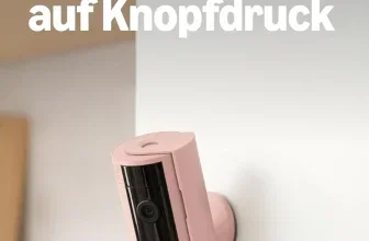 Rosa Ring Indoor Kamera an der Wand mit Text Privatsphäre und Sicherheit auf Knopfdruck