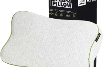 Weißes BLACKROLL Recovery Pillow mit grüner Kante vor der schwarzen Verpackung mit Produktname und Made in Germany-Label