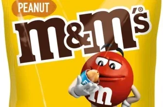 Gelbe M&M's Peanut Tüte mit 150g Angabe und rotem Maskottchen, das eine Erdnuss isst.
